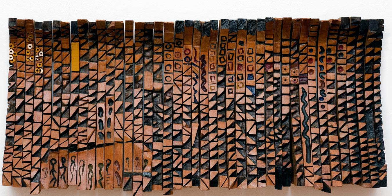 El Anatsui, Leopard's Paw Prints and Other Stories, 1991. Tropical hardwoods, 41 x 91 cm.