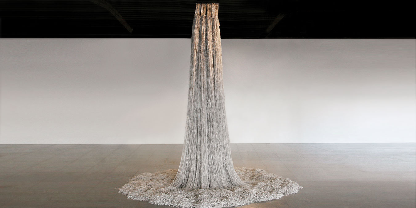 Jukhee Kwon, /fromthebooktothespace/, 2012. 10 books and bookcase, various dimensions. Image courtesy La Scatola Gallery