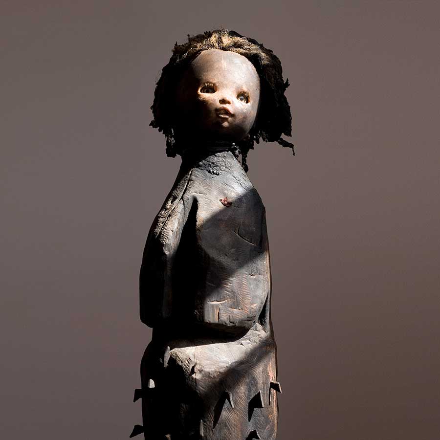 Gérard Quenum, Mère du Secret (Mother of Secrets), 2008. Wood, doll, plastic and metal, 200 x 30cm.